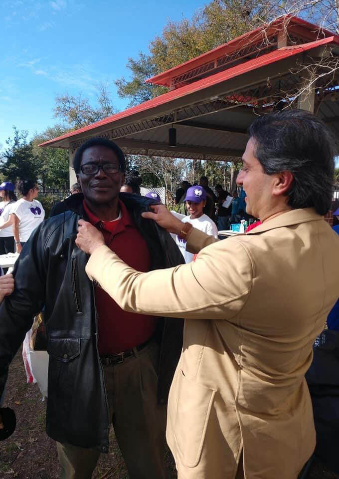 Dr. Gulani Fixing Someone's Jacket