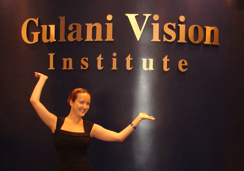 Woman Highlighting Gulani Vision Institute Logo