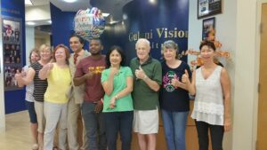 Dr. Gulani with international patients, including Melissa K., all celebrating vision restored at the world’s repair center for complex eye conditions.