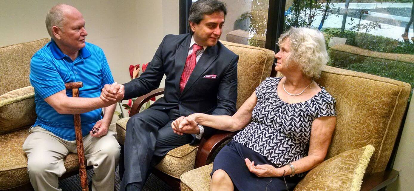 Dr. Gulani Holding Patients Hands
