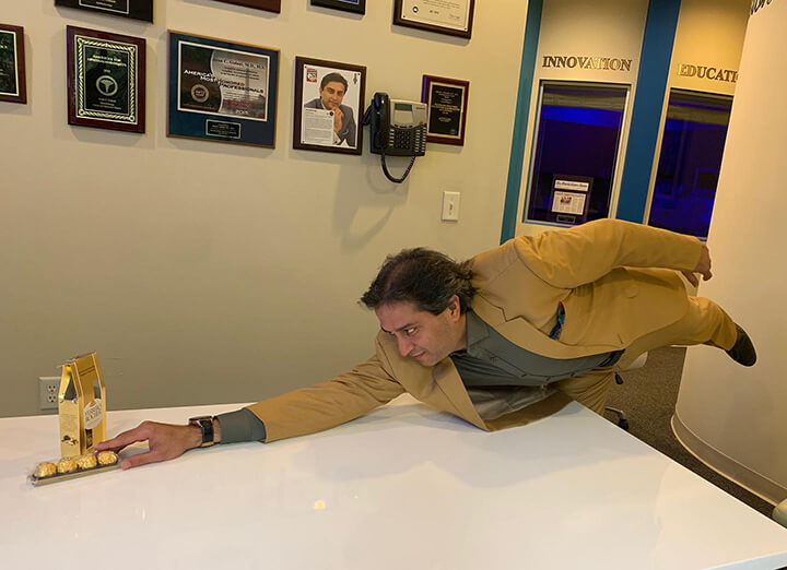 Dr. Gulani Doing Yoga While Reaching For Chocolate