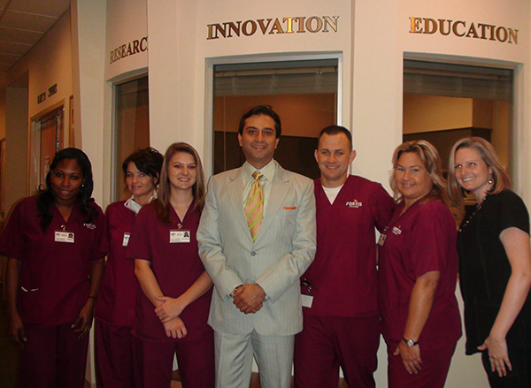 Dr. Gulani With Staff