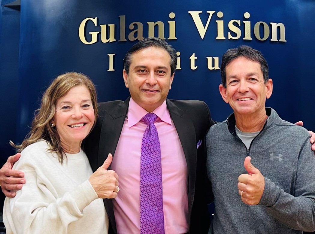 Radial Keratotomy patient and spouse smiling with eye surgeon after complex RK vision correction at Gulani Vision Institute Jacksonville Florida showing successful outcome and restored vision