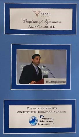 Dr. Gulani receiving an award at the STAAR Symposium for his contributions to advanced vision correction and ICL surgery.