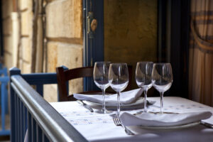 An empty table with wine glasses